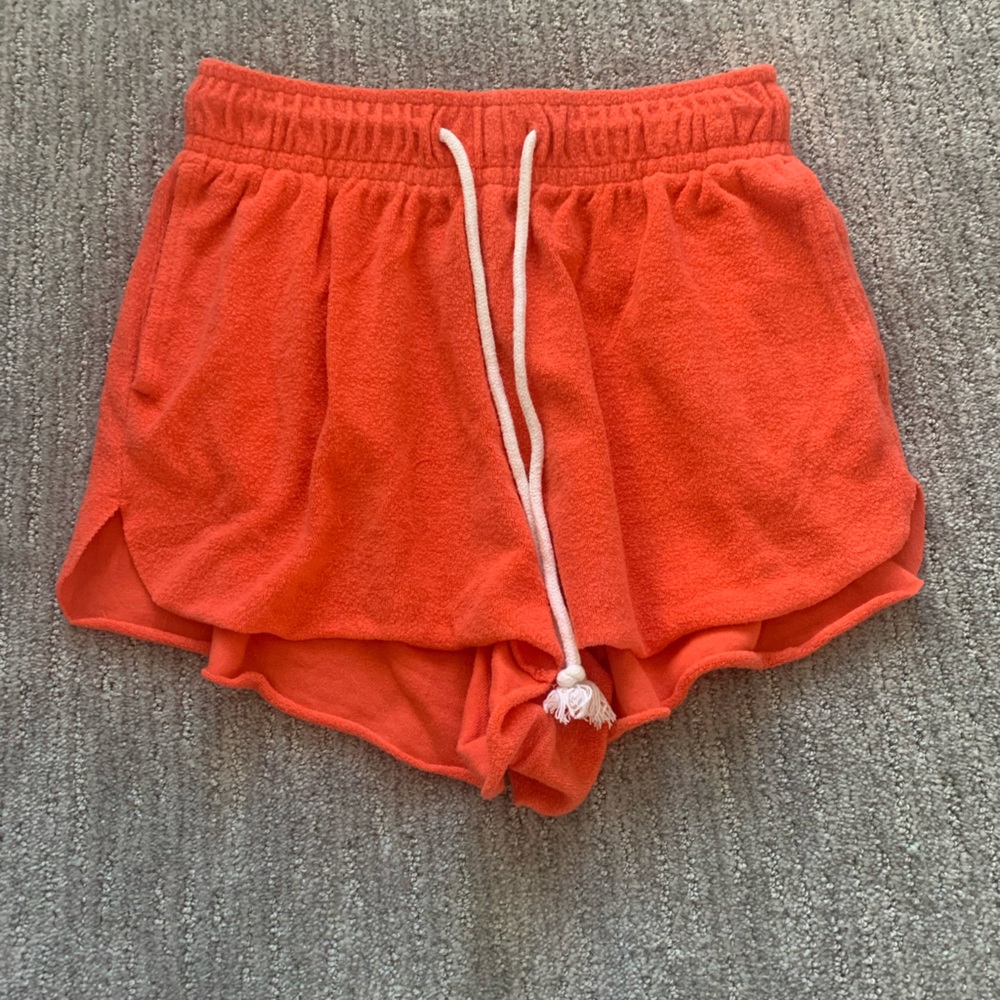 Has a little pink in it, adjustable waist, has pockets